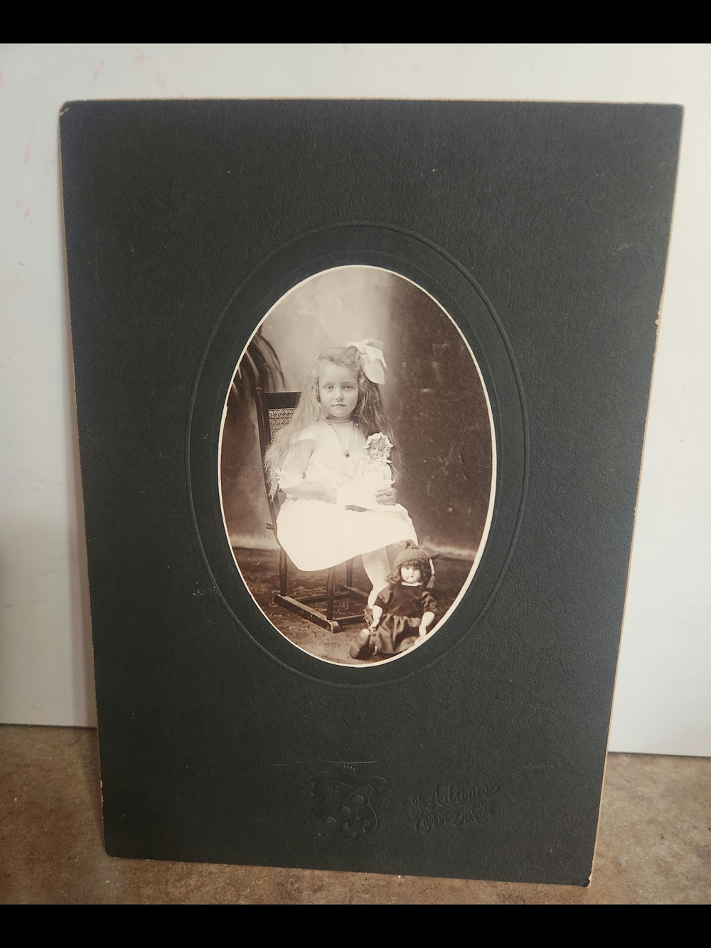 F. Adams Photographic Studio Black Oval Photo Mat with Mounted Sepia Portrait